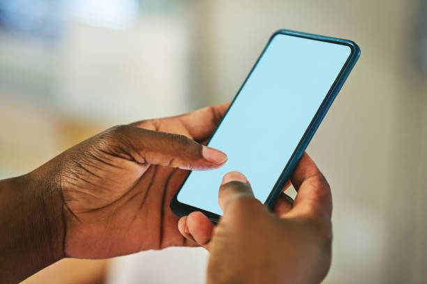 Cropped shot of an unrecognisable woman using a smartphone